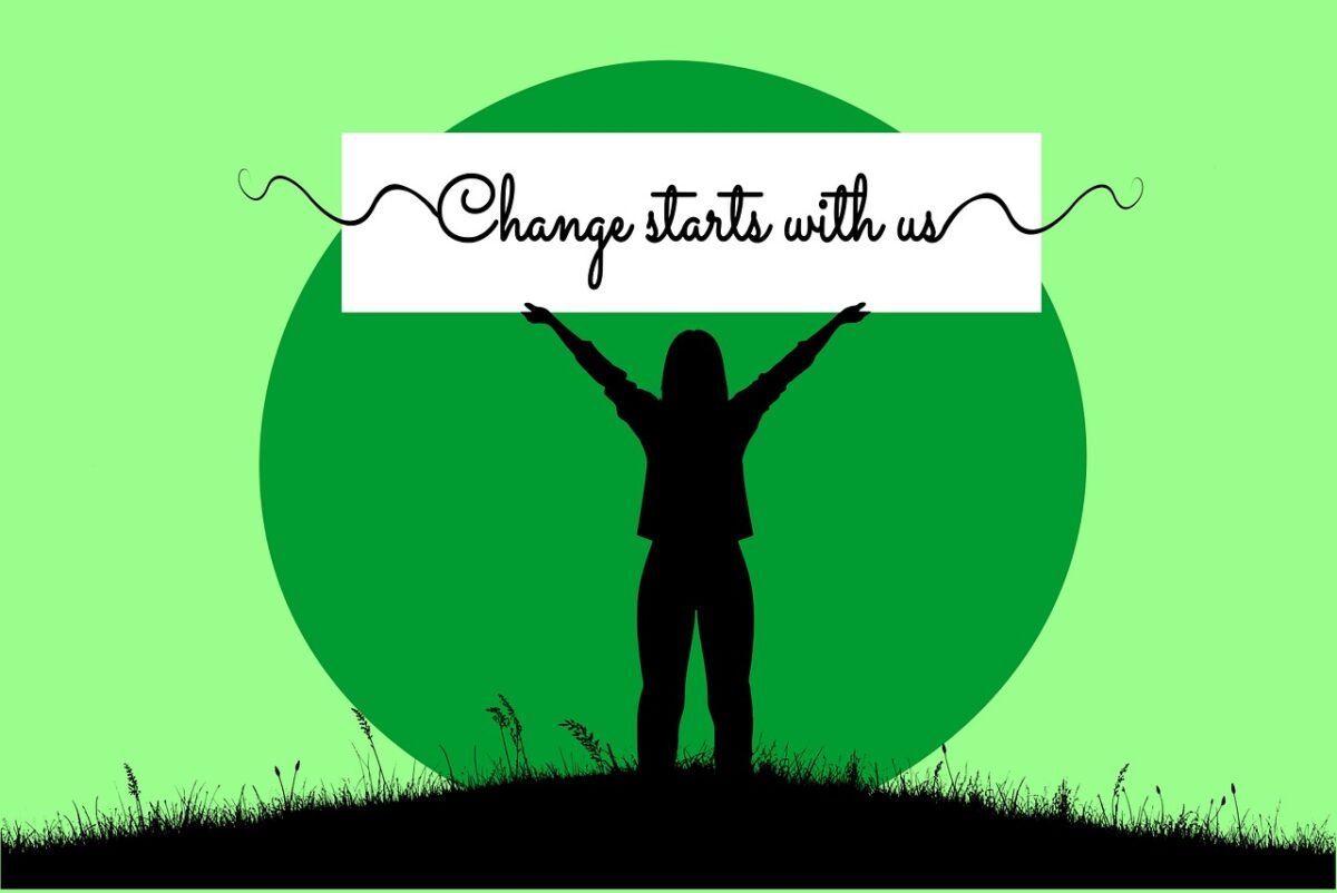 green background with silhouette of female with arms raised and text that says "Change starts with us"